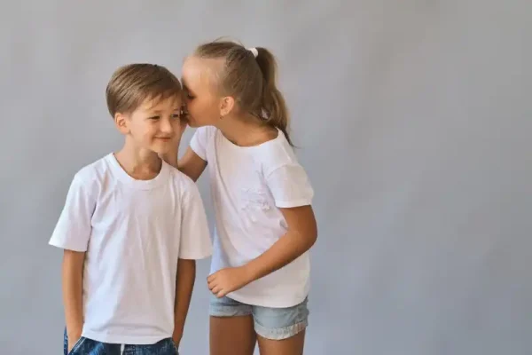 cute-two-kids-little-boy-girl-white-t-shirts-gray-background-person